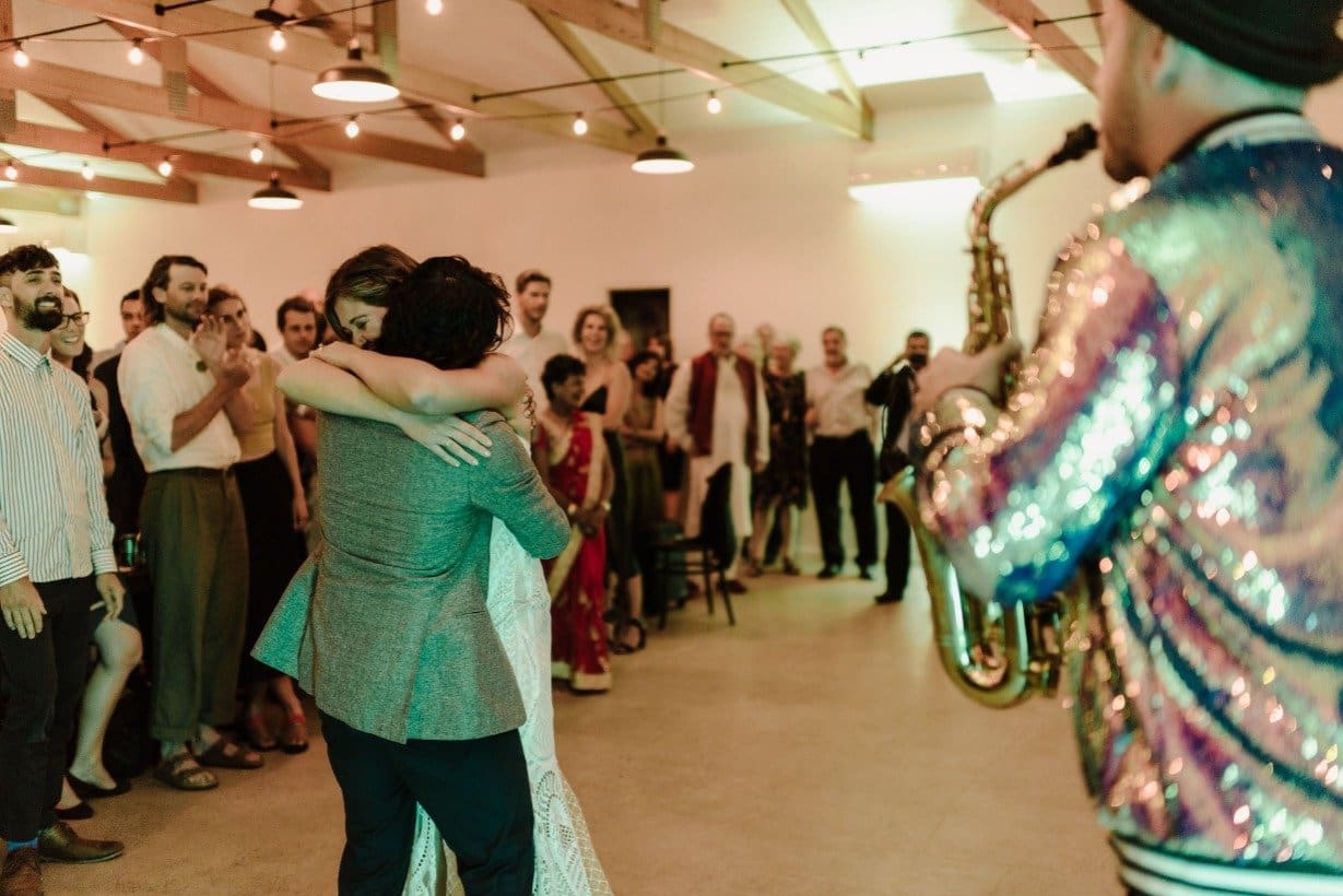 Bride And Groom Sway To First Dance With Saxophone