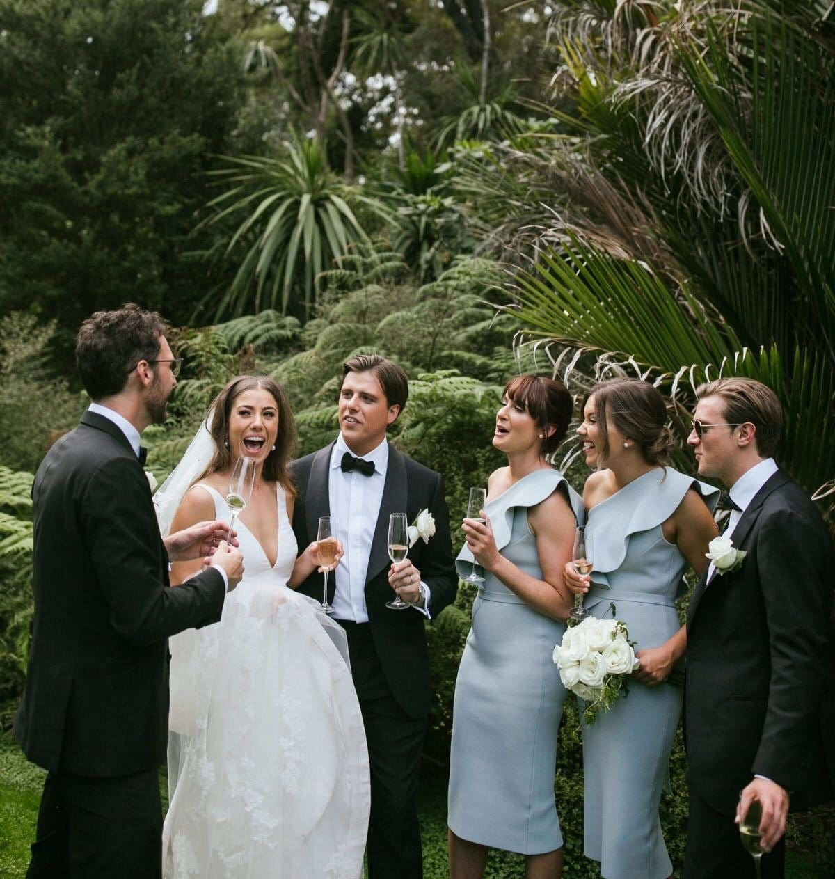 Bridal Party Poses In Melbourne Botanical Gardens For Wedding Photos