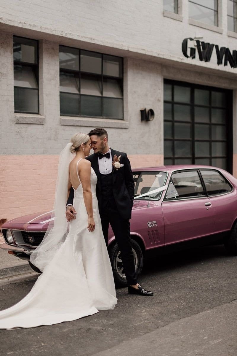 Melbourne Bride And Groom Pose Near Glasshaus Wedding Venue