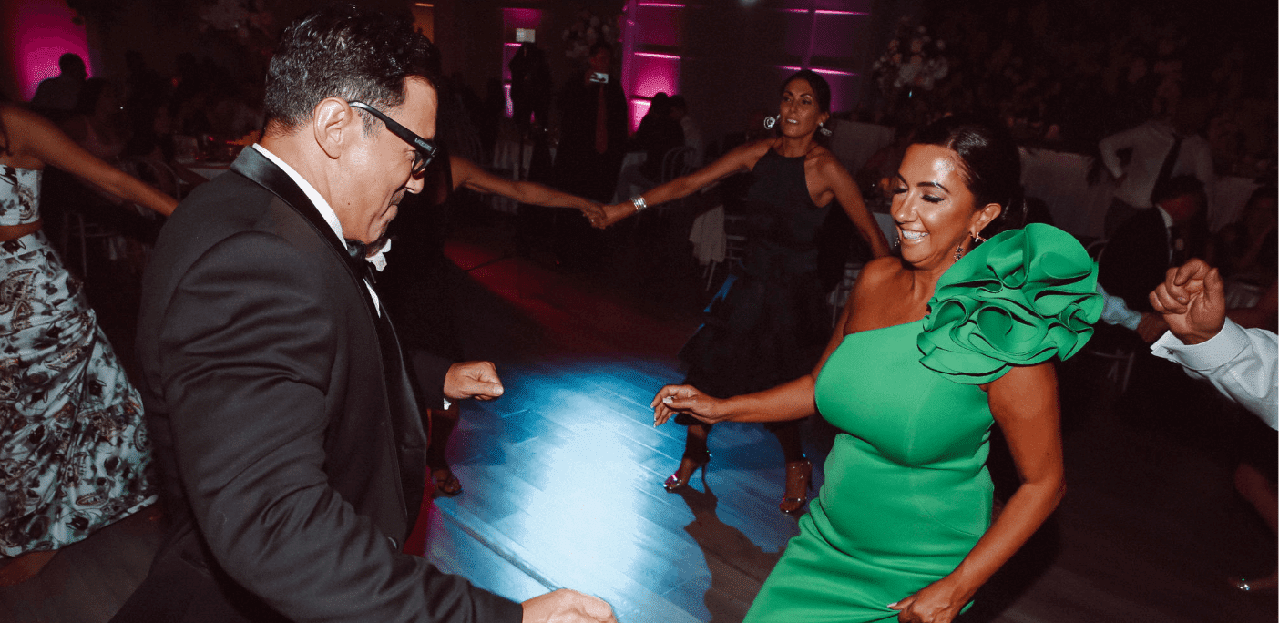 Father-And-Mother-Of-The-Groom-Dance-With-Guests-At-Crown-Aviary-Melbourne-Wedding