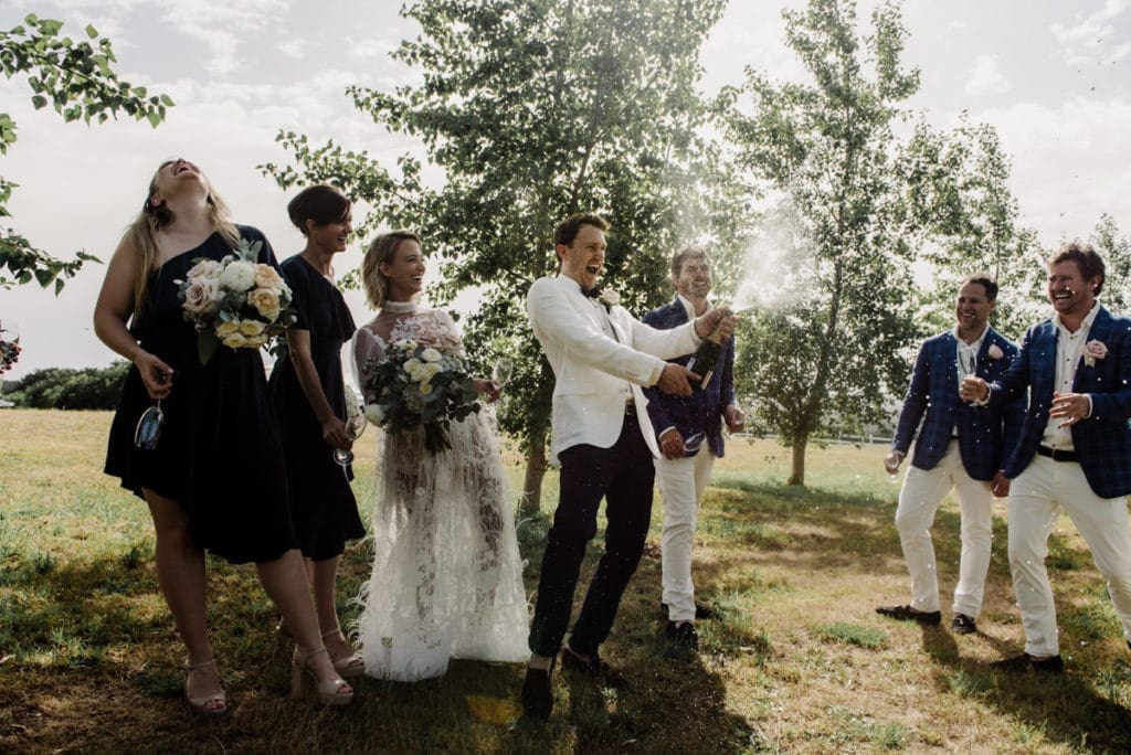 Bride And Groom Celebrate With Champagne After Their Wedding Ceremony