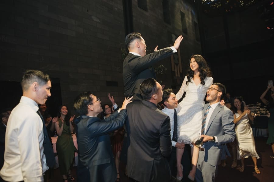 Wedding Couple Dance On Guests' Shoulders AT National Gallery Of Victoria Wedding