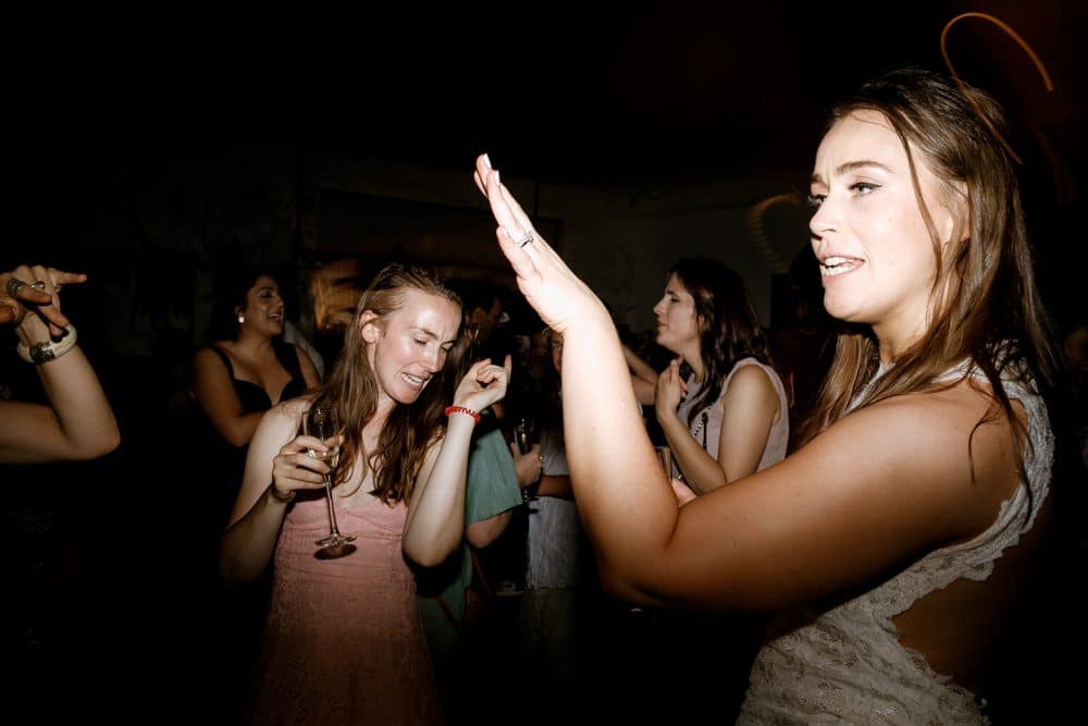 Bride Dances With Guest At Wedding In Thornbury