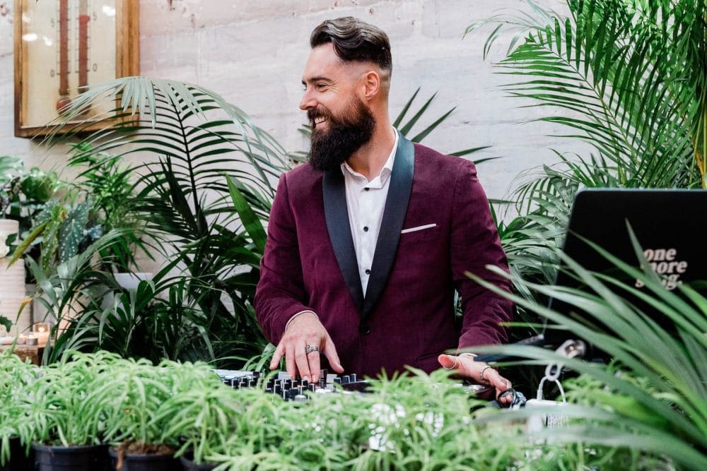 Wedding DJ Eddy Mac Poses Behind The Decks At Glasshaus Melbourne