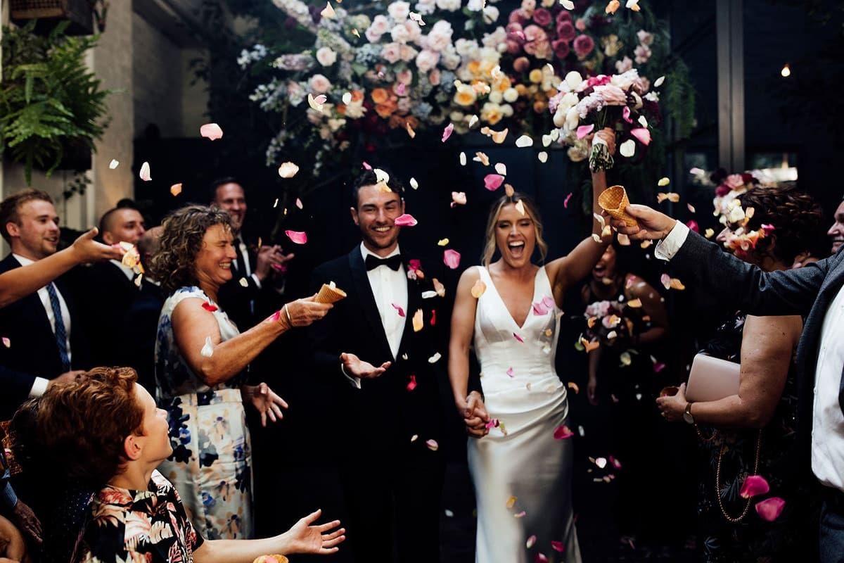 Newly-Married-Couple-With-Colourful-Rose-Petals-Rupert-On-Rupert-Photographed-By-Fern-and-Stone-Photography