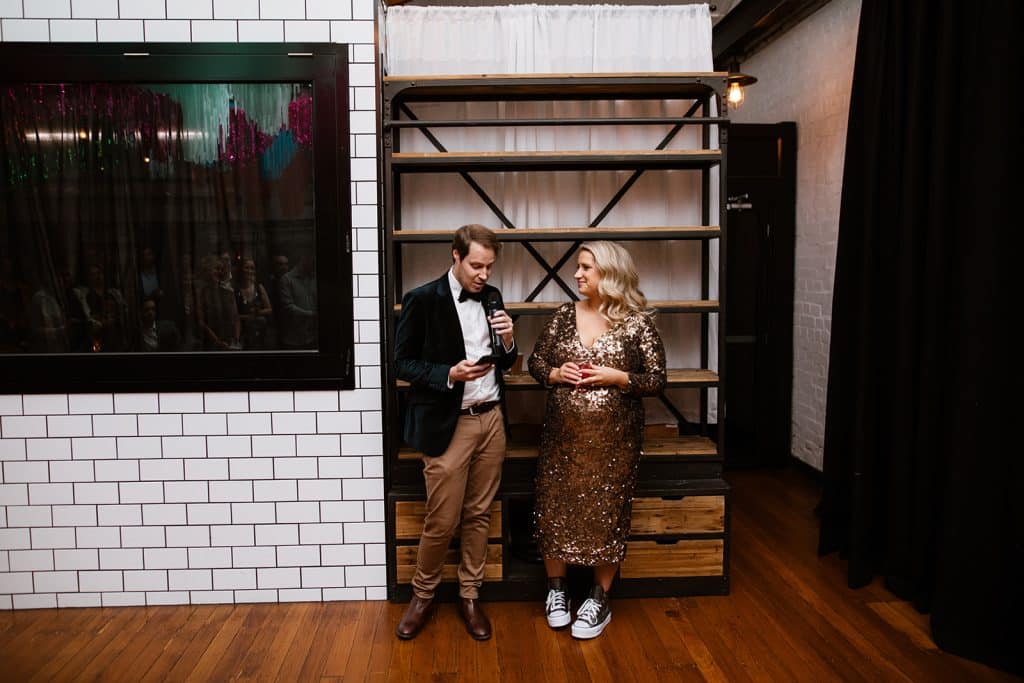 Relaxed-Bride-and-Groom-Making-Wedding-Speech-at-Craft-and-Co-Collingwood-by-Brendan-Creaser-Photography