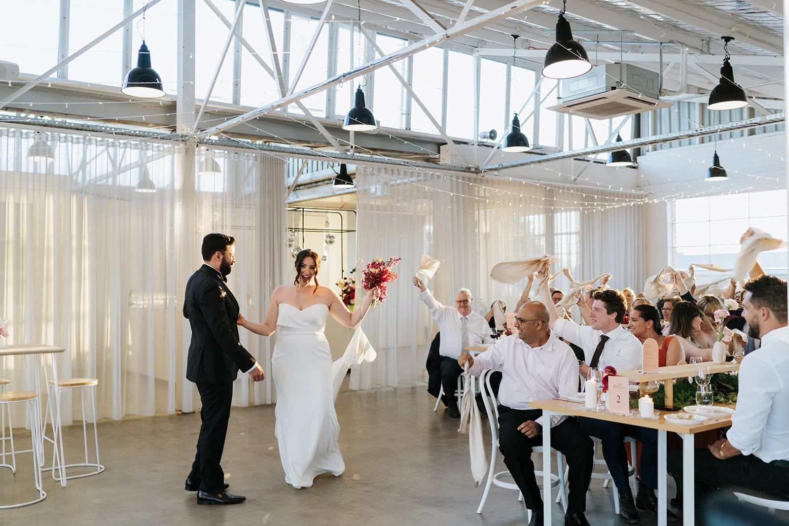 Bride-and-Groom-Wedding-Entrance-at-The-Button-Factory-Photographed-by-Art-Of-Grace